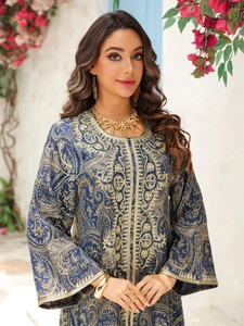 Exquisite gold paisley embroidery and detailed beadwork on deep blue kaftan evening gown