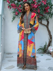 Detail of vibrant floral print dress with bohemian geometric pattern on the neckline