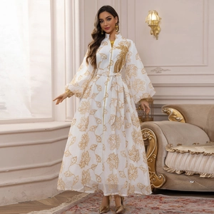 Elegant white Jalabiya dress with gold leaf embroidery and long lantern sleeves
