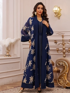 Detail view of navy blue Abaya set featuring golden palm leaf embroidery on chiffon fabric