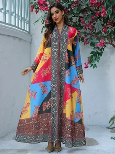 Detail of V-neck long sleeve abaya dress with floral print and geometric pattern