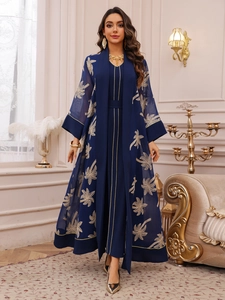Detail of navy blue chiffon robe with golden palm leaf embroidery and fine piping