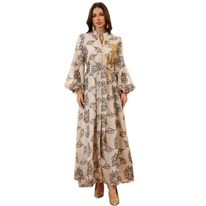 Beige Jalabiya kaftan dress with black leaf print and gold sequin embroidery details