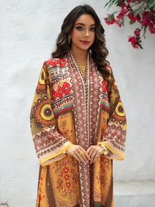 Detailed V-neck of ethnic print chiffon maxi dress with golden trim and sparkling rhinestones
