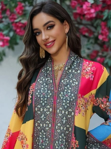 Close-up of ethnic color block dress with floral patterns and sequin embellishments