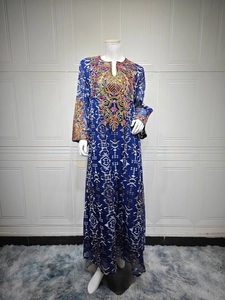 Detail of navy mesh maxi dress featuring ethnic floral embroidery and geometric prints