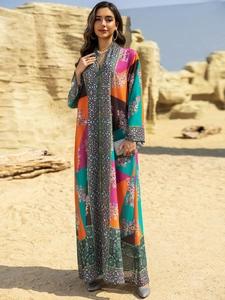 Detail of bohemian floral print kaftan dress with geometric patterns and V-neckline