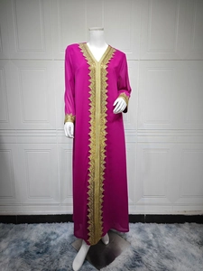 Close-up of golden lace embroidery on magenta chiffon Kaftan dress neckline and cuffs