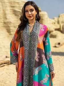 Detail of bohemian floral print maxi dress with rhinestones and geometric patterns