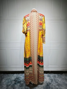 Back view of bohemian long yellow chiffon dress with ethnic prints and rhinestone accents