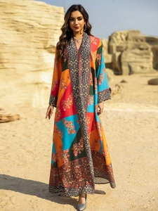 Close-up of ethnic paisley patterns and floral print on long sleeve V-neck kaftan dress