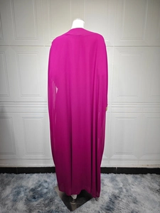 Detail of the back view of a fuchsia chiffon maxi dress featuring elegant drape and lace trim