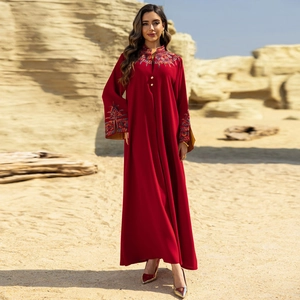 Elegant wine red long sleeve maxi dress with floral embroidery in a desert setting