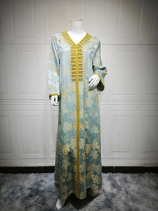 Detail of light blue Kaftan with gold maple leaf prints and beaded embroidery work