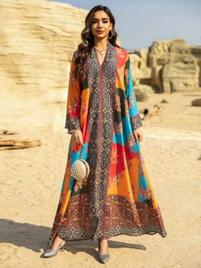 Close-up of vibrant ethnic printed kaftan dress with intricate patterns and boho details