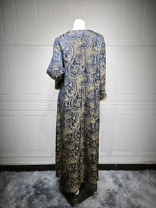 Blue and gold paisley jacquard kaftan dress showing back view and long sleeve details
