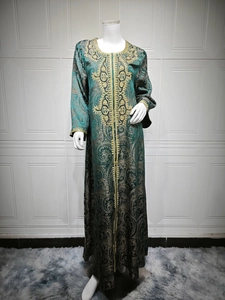 Detailed embroidery and gold beadwork on dark green paisley kaftan dress