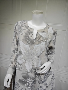 Detail of sequins and beads embroidery on V-neck floral embroidered dress