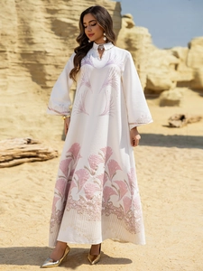 Close-up of pearl white maxi dress with pink floral jacquard and small stand collar
