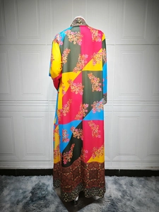 Detailed back view of a colorful bohemian printed long dress with intricate ethnic patterns