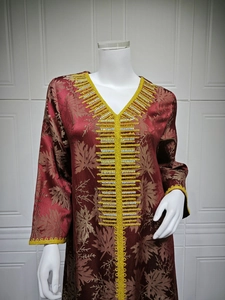 Detail of V-neck embroidery and sequins on dark red jacquard long sleeve kaftan dress