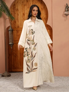 Detail of sequin floral embroidery on cream lapel long-sleeved ethnic maxi dress