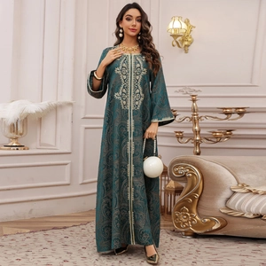 Elegant emerald green kaftan dress with gold embroidery and vintage floral patterns