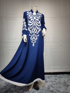 Detailed white embroidery on navy long-sleeved ethnic maxi dress with v-neckline