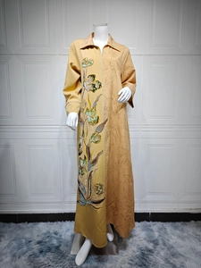 Detail of floral sequin embroidery on asymmetric long sleeve ethnic abaya dress