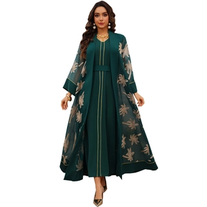 Elegant dark green two-piece abaya set with gold palm tree embroidery and matching inner dress
