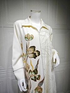 Detailed embroidery with sequins and jacquard patterns on cream long dress