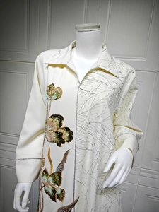 Detailed embroidery with sequins and leaf vein pleated texture on long beige dress