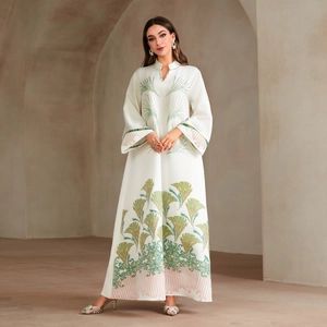 White long sleeve maxi dress featuring elegant green and pink leaf embroidery details