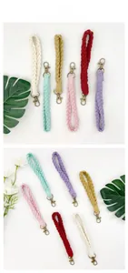 Macro view of multi-color braided cotton wrist lanyards with metal lobster clasps