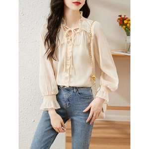 Elegant beige ruffle V-neck chiffon blouse with lantern sleeves and romantic tie detail