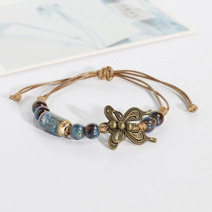 Vintage style handmade woven ceramic bracelet with bronze butterfly charm for women