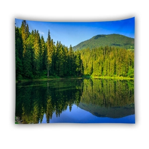 Detailed view of forest lake tapestry showing sharp pines and mountain reflections on fabric