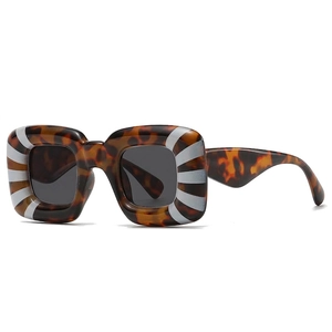 Retro square tortoiseshell sunglasses with distinctive side stripe pattern and grey lenses