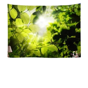 Nature forest tapestry with sunlight through green leaves hanging on a white bedroom wall