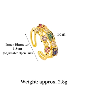 Adjustable 18K gold geometric ring featuring colorful zirconia stones on a white background