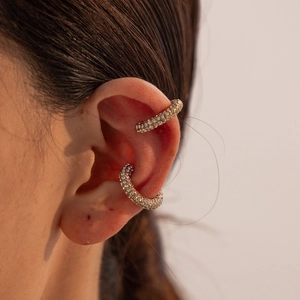 Close-up of 18K gold plated ear cuffs with micro-paved white zircons on ear cartilage