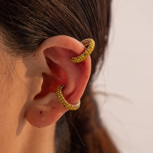 Macro shot of 18K gold plated C-shaped ear cuffs with micro-paved yellow zircons