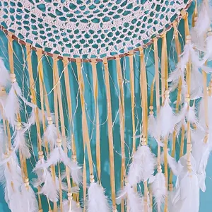 Large Indian dream catcher wall decor with white feathers and warm LED fairy lights