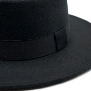 Classic vintage black wool felt flat brim hat with wide grosgrain ribbon band and bow accent