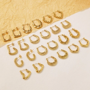 Set of ten pairs of gold geometric stainless steel hoop earrings in various vintage styles