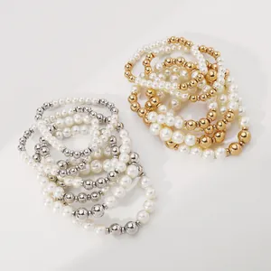 Elegant multi-layered pearl bracelet set with gold and silver metallic accent beads