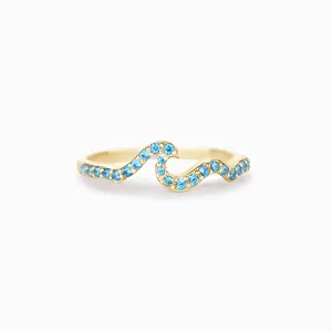 Elegant wavy s925 silver ring in gold finish with sparkling blue gemstones
