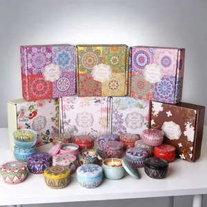 Detailed view of soy wax candles in mandala tin containers and floral gift packaging
