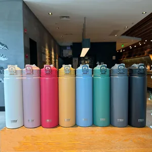 Row of TYESO insulated water bottles in various colors on a wooden table with carry loops