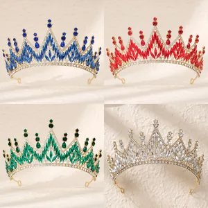 Detailed close-up of Baroque crowns with colorful marquise crystals and gold metal finish